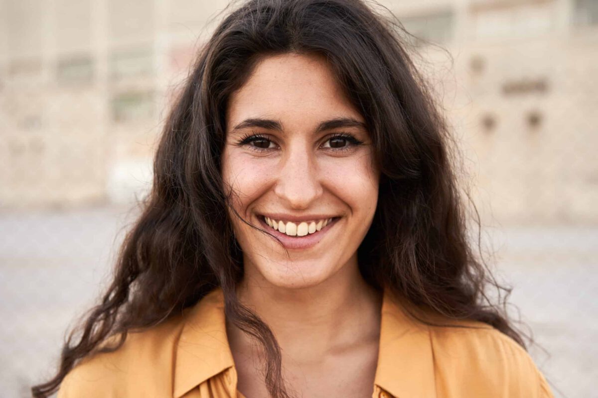 cute young woman looking at camera smiling happy 2023 11 27 05 07 42 utc scaled 1